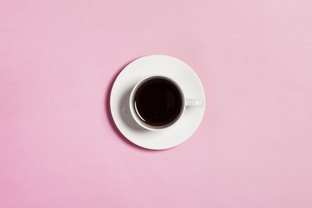 A cup of coffee on pink backgroundの写真素材