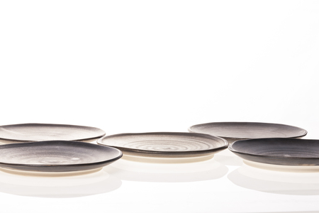 A grey ceramics dishes isolated on white backgroundの写真素材