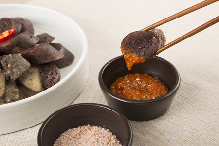 Food photo - famous snack and street foods in Korea. Stir-fried rice cake, Korean sausage, Kimbap,...