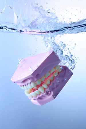 Spread, various objects in water and air bubbles over white background. 008