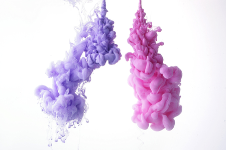 Spread, color drop falling in water creating a color spread. Colorful ink drop.の写真素材