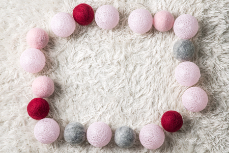 Objects photo for winter season. Christmas wool balls for Christmas ornament on a furry backgroundの写真素材