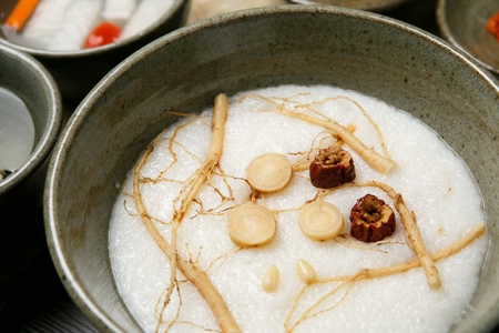 Korean food collection photo_Ginseng White rice in bowl top view Porridge, white soup made of ginseng its good for healthy 2の写真素材