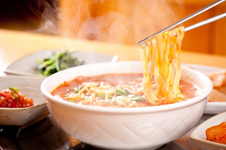 Korean food collection photo_eolkeun Noodle Soup, chopped noodles in broth from anchovy, onions, potatoes, and more in bowl top view 1の写真素材
