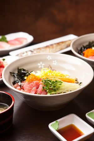 Korean food collection photo_Raw Fish Bibimbap, mixed White rice in bowl top view, raw fish and vegetables 6の写真素材