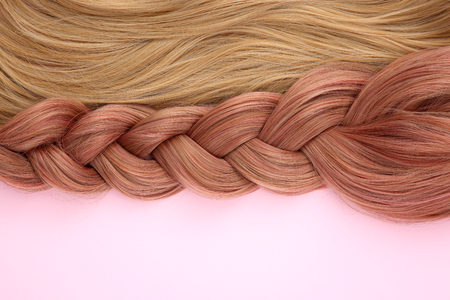 Long colorful hair with objects related to hair salon on close up isolated on background. 072の写真素材