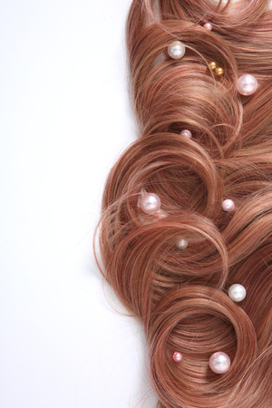 Long colorful hair with objects related to hair salon on close up isolated on background. 031の写真素材