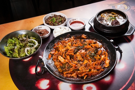 Spicy Korean food pork intestines stir-fried with vegetables and spicy sauceの写真素材