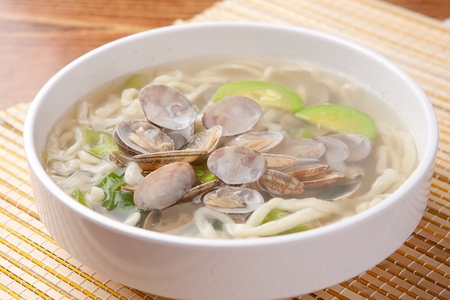 Korean handmade noodle kalguksu with manila clams, close-up shotの写真素材