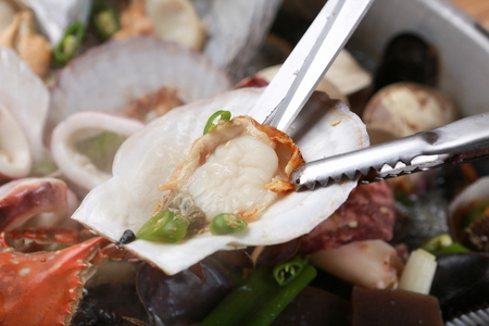 Steamed clams served with various vegetables