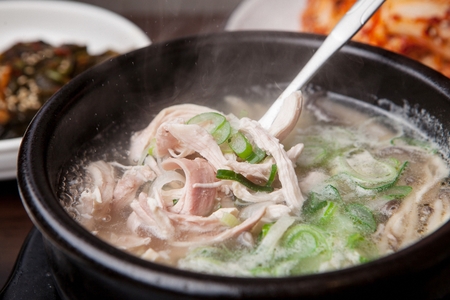 Korean cuisine Gom tang, beef bone soup in clear brothの写真素材
