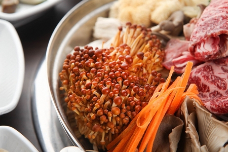 Close-up shot of Korean cuisine, spicy mushroom stew with beef