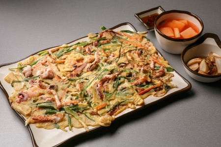 Korean pancake, pajeon with seafood and green onion leeks, Korean cuisine Jeonの写真素材