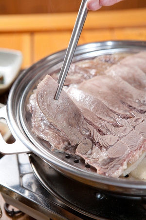 Korean cuisine suyuk, boiled beef or pork slicesの写真素材