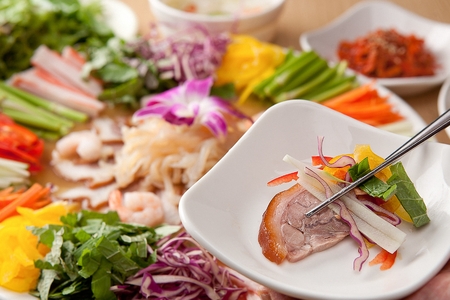 Korean cuisine naengche jokbal, boiled pigs' feet served with cold vegetables