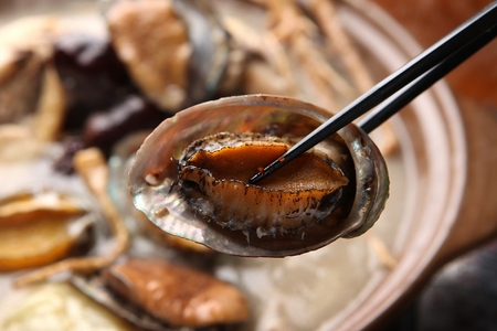 Korean cuisine chicken baeksuk, boiled chicken soup with abaloneの写真素材