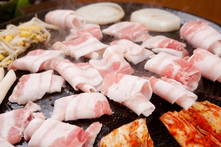 Korean barbecue Samgyeopsal, grilled think pork bellyの写真素材