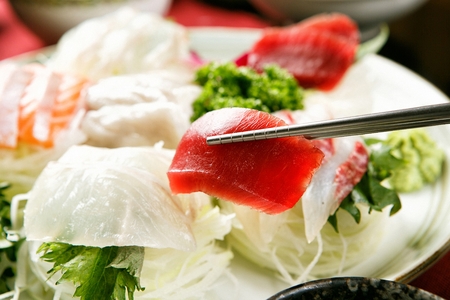 Korean style assorted sashimi platter, chopsticks, close-up shotの写真素材