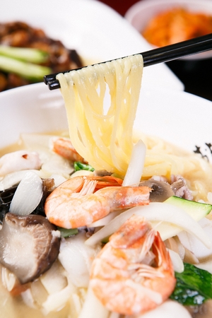 Korean-Chinese style seafood noodles clear white soup, Baek Jjambbongの写真素材