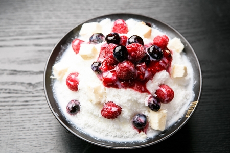 Korean Bingsu, cranberry fruit ice flakes with syrupの写真素材