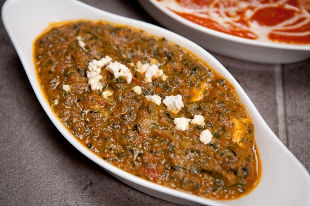 Palak paneer(Indian cheese) in a thick paste made from spinach, and garlic