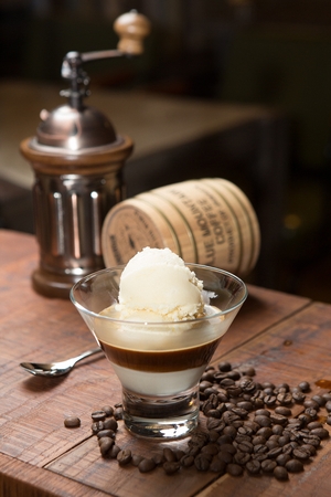 Scoop of ice cream topped with espressoの写真素材