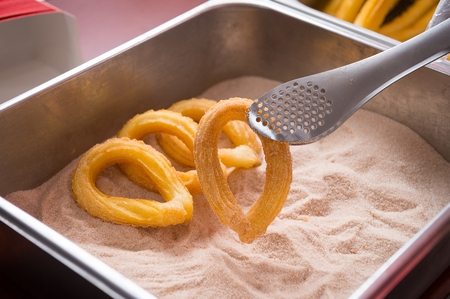 Bread dipped in syrup (Churros)