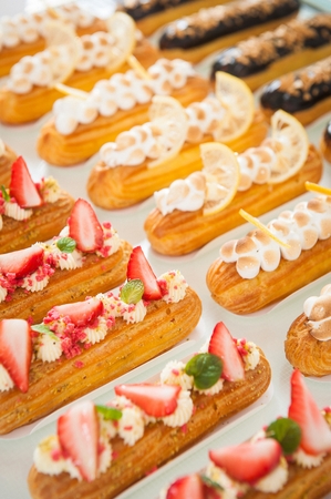 Long cream cake with toppings on top