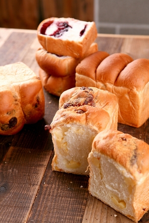 various loaf breads on wood table