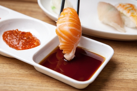 salmon sushi and soy sauceの写真素材