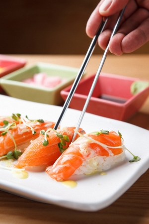 chopsticks and salmon sushi plateの写真素材