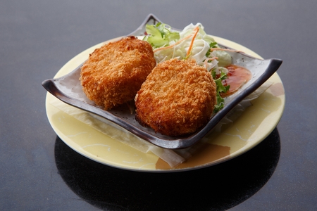 Thin crackers served with various toppingsの写真素材