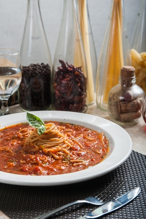 Arrabiata pasta and pasta ingredients on a tableの写真素材