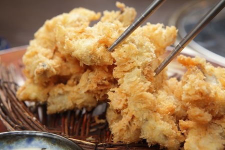 Fried dishes in a basket, close-upの写真素材