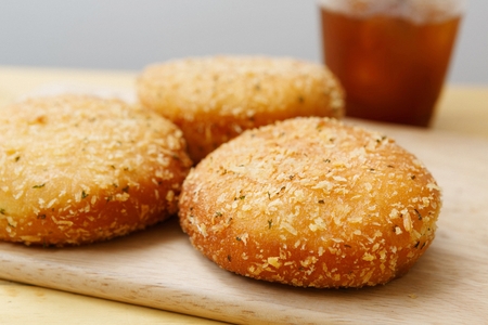 Croquette in a wooden plate, on a wooden table