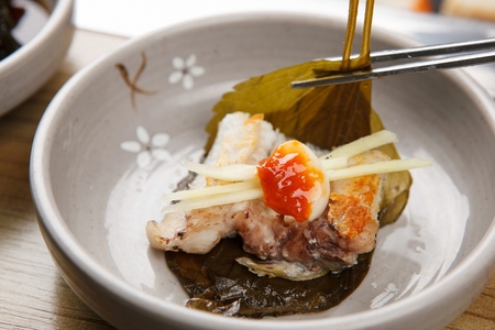 Eels on plate wrapped in perilla leafの写真素材