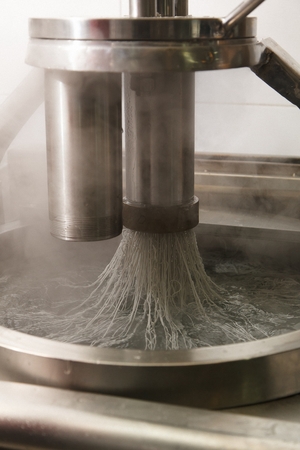 Machine making wheat noodles for naengmyeon, korean style cold noodle dishの写真素材