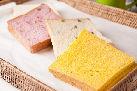 White bread, yellow bread, pink bread in bakery