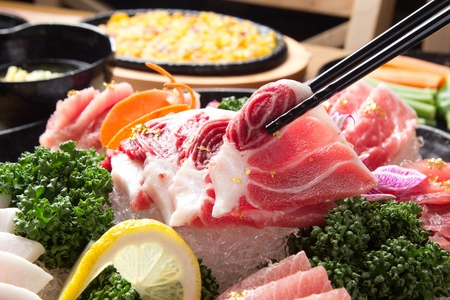 Chopsticks grabbing tuna sushiの写真素材