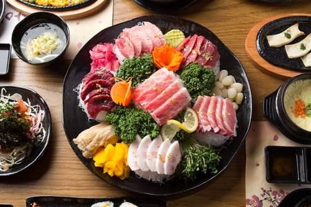 Tuna sashimi, on a black plateの写真素材