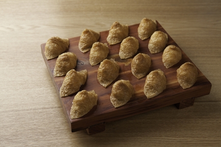Cone sushi, a Japanese cuisine on a wooden cutting board