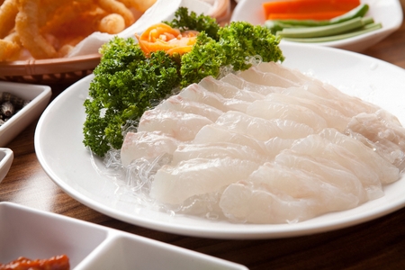 Rockfish sashimi, raw rockfish sliced thinly, and fried dishesの写真素材