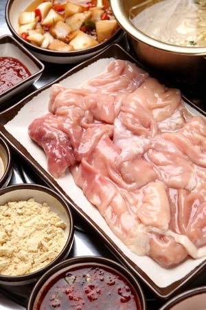 Closeup of beef tripes, on a white square plateの写真素材