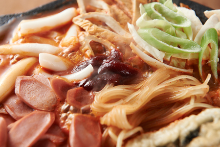 Tteokboki, a Korean cuisine, rice cake and fish cakes stir-fried with spicy sauce, boiled in a potの写真素材