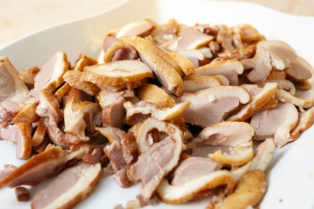 Smoke duck, on a white plateの写真素材