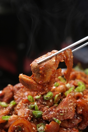 Yangnyeom-jokbal, thinly sliced pork served in sweet and spicy sauceの写真素材