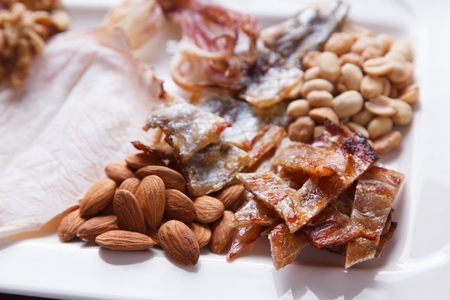 Peanuts, filefish fillet, little pollacks, almonds and octopusの写真素材