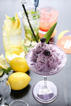 Cocktail with blueblerry in glassの写真素材