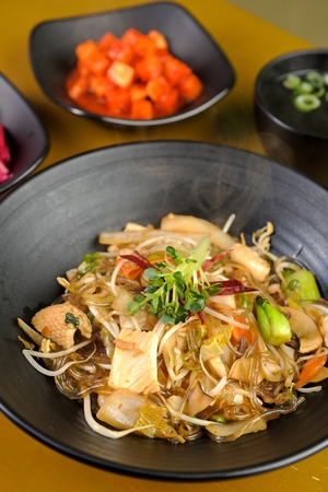 Chinese-style stir-fried Glass Noodles and Vegetables with Rice (japchae-dupbap)の写真素材
