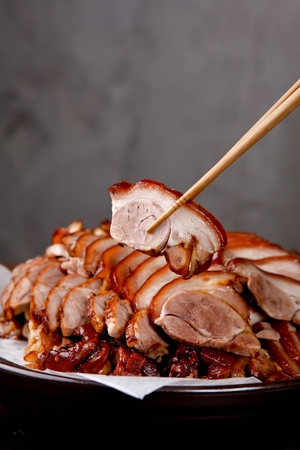 Chopsticks picking up Jokbal, thinly sliced boiled pork feetの写真素材